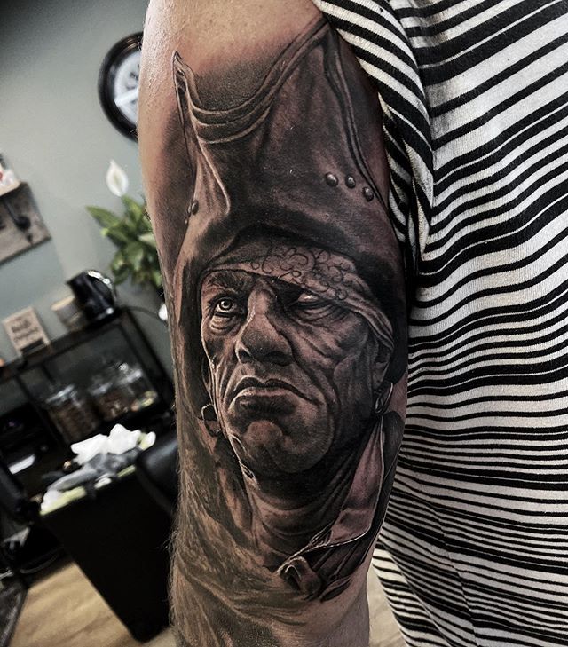 Tattoo of a pirate on the shoulder for men