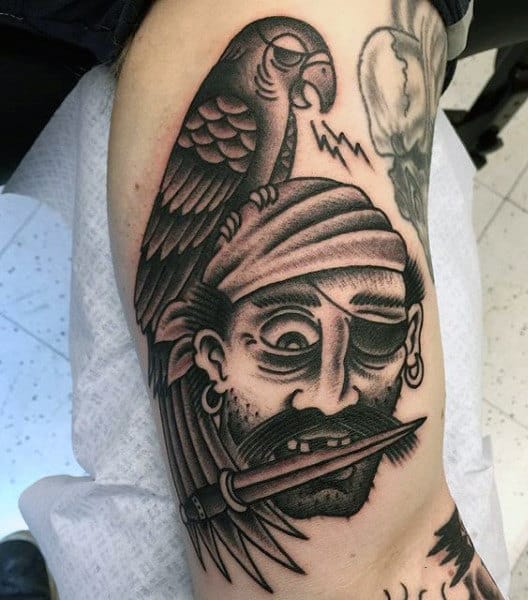 Tattoo of a pirate on the shoulder for men