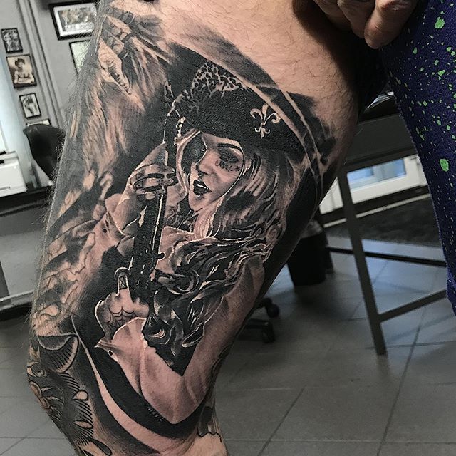 Tattoo of a pirate on the hip for men