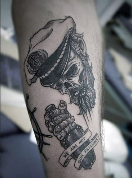 Tattoo of a pirate on the shin for men