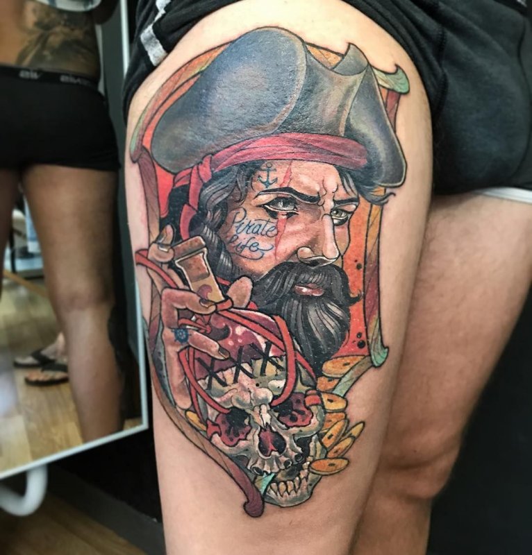 Tattoo of a pirate on the hip for men