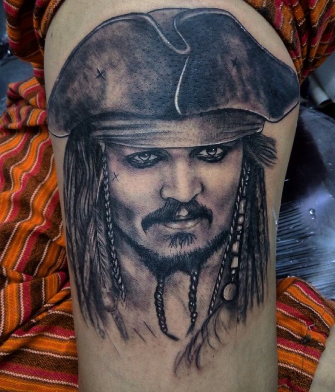 Tattoo of a pirate on the hip for men