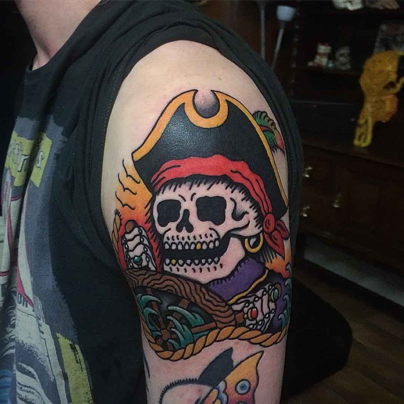 Tattoo of a pirate on the shoulder for men