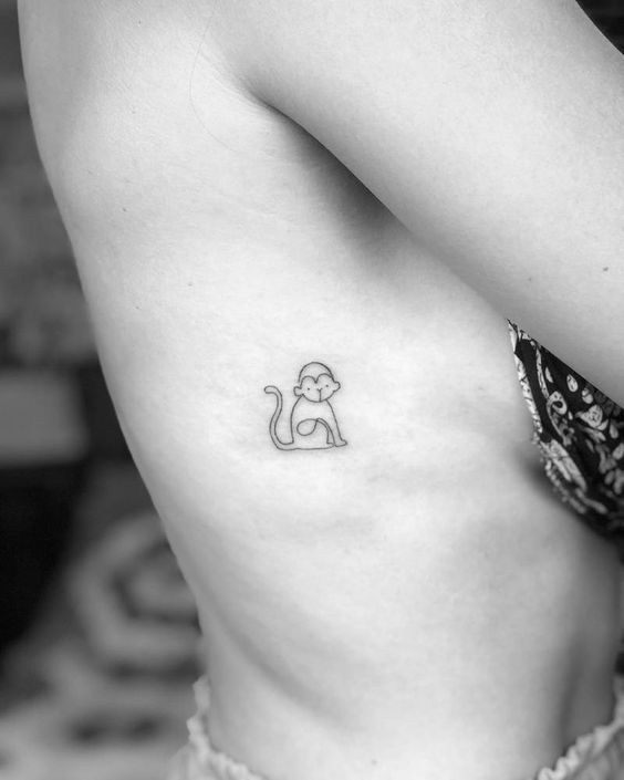 Monkey tattoo on the side for women