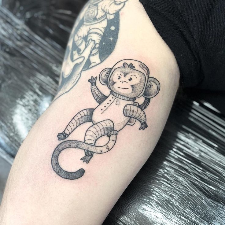 Monkey tattoo on the shoulder for men