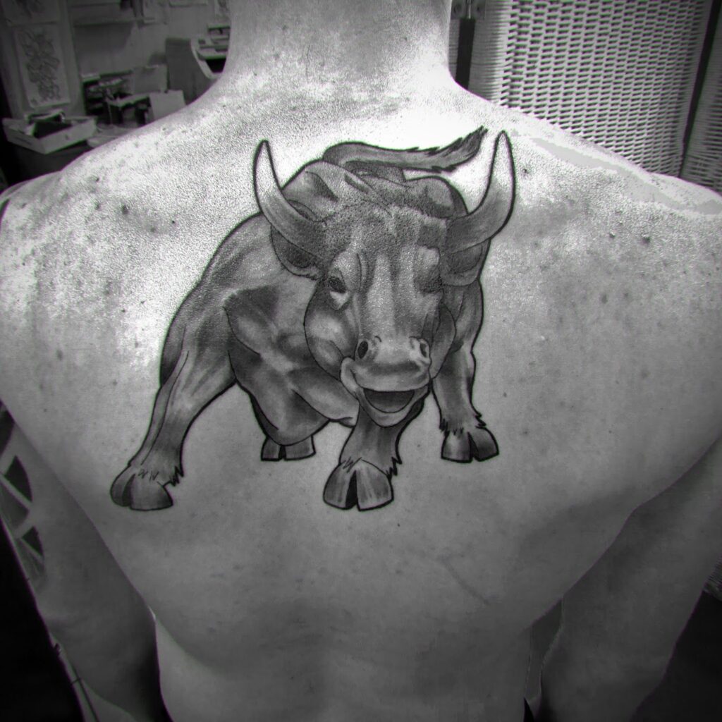 Bull tattoo on the back for men