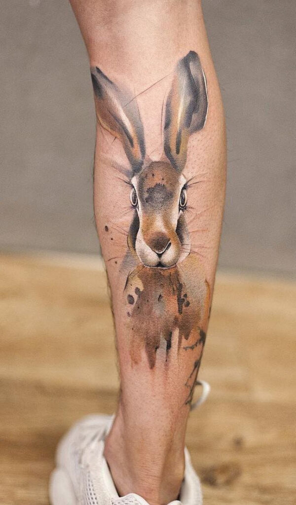 Tattoo of a hare (rabbit) on a calf for men