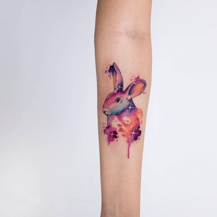 Tattoo of a hare (rabbit) on the forearm for women