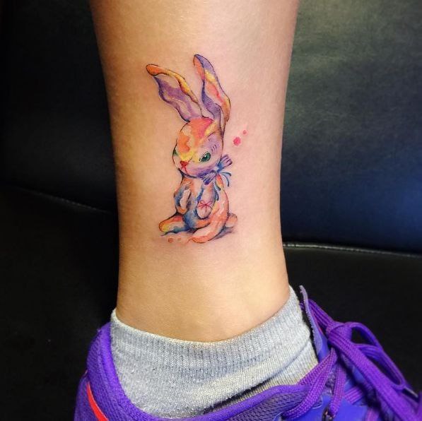 Tattoo of a hare (rabbit) on the shin for women