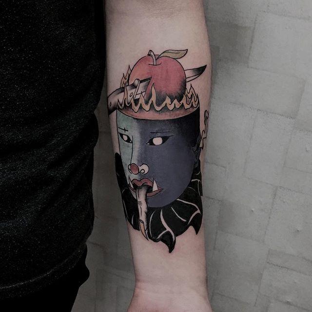 Tattoo of a clown on the forearm for men