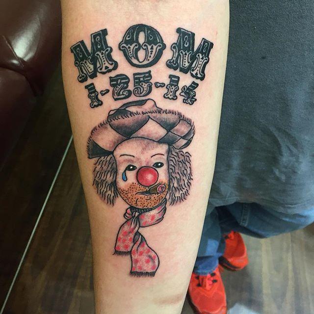 Tattoo of a clown on the forearm