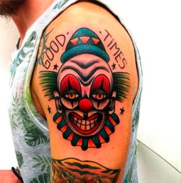 Tattoo of a clown on the shoulder for men