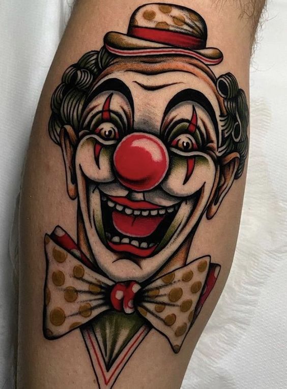 Tattoo of a clown on a calf