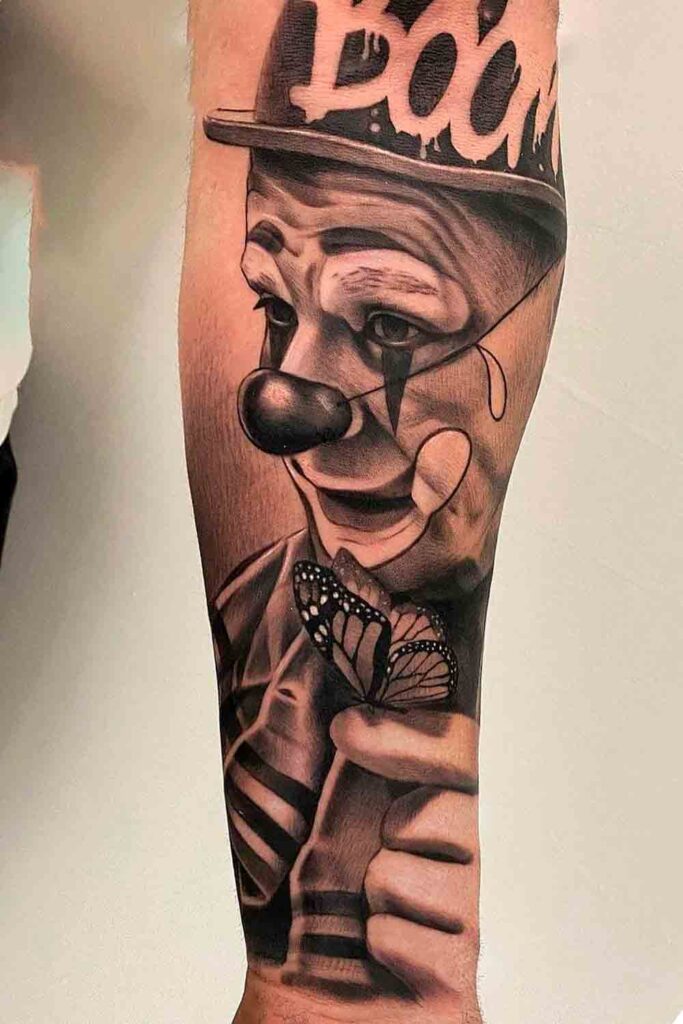 Tattoo of a clown on the arm for men