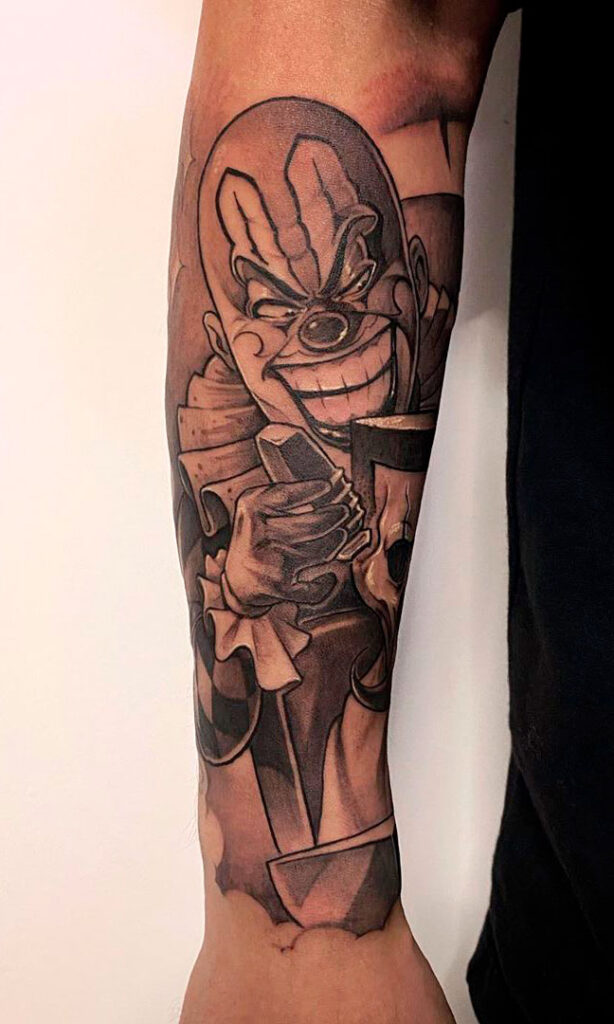 Tattoo of a clown on the forearm for men