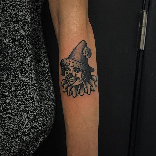 Tattoo of a clown on the forearm