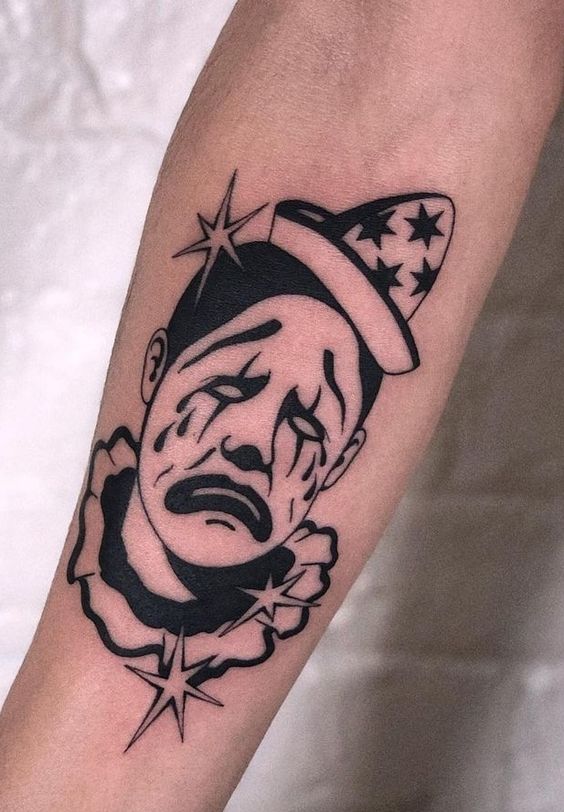 Tattoo of a clown on the forearm