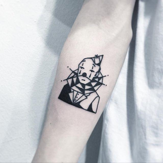 Tattoo of a clown on the forearm for men