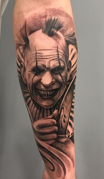 Tattoo of a clown on the forearm for men