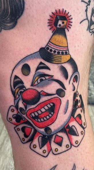 Tattoo of a clown on the leg for men