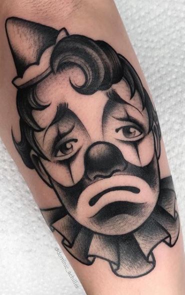 Tattoo of a clown on the forearm