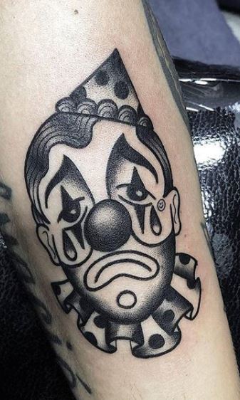 Clown tattoo on arm