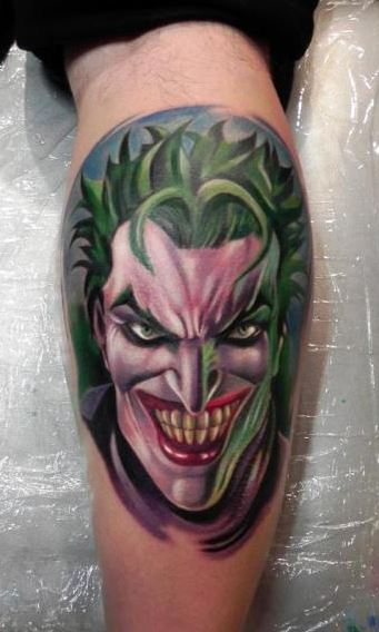 A clown tattoo on the calf for men