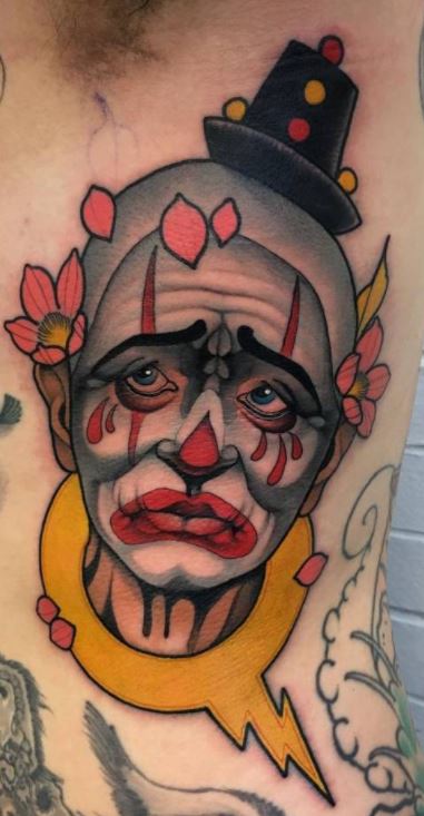 Tattoo of a clown on the side for men