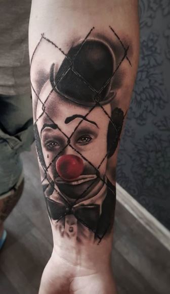 Tattoo of a clown on the forearm for men