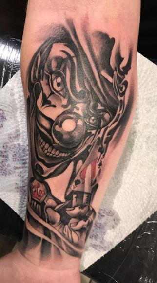 Tattoo of a clown on the forearm