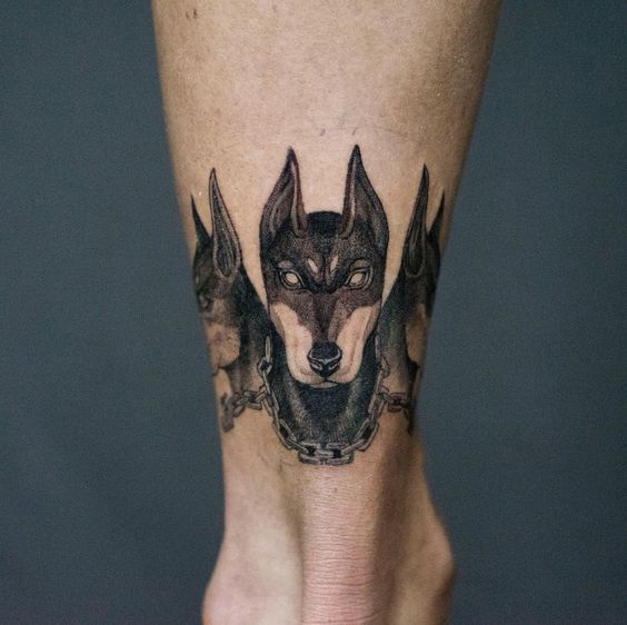 Tattoo of a doberman on the leg for men