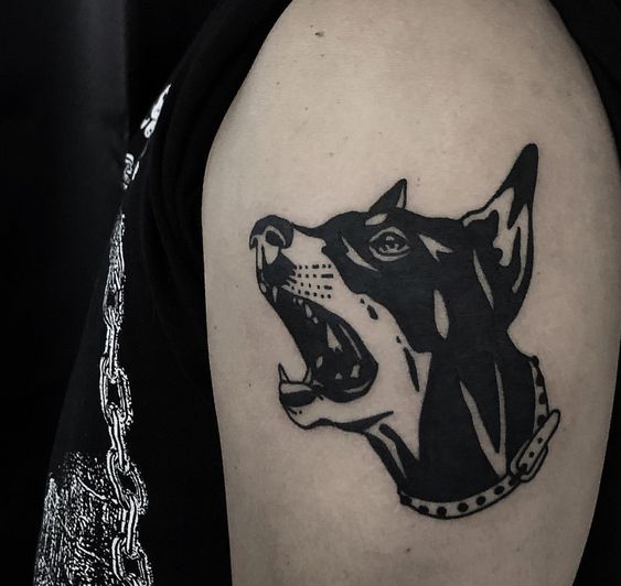 Tattoo of a doberman on the shoulder for men