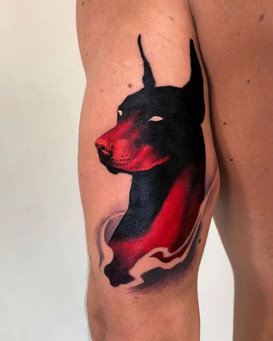 Tattoo of a doberman on the shoulder for men