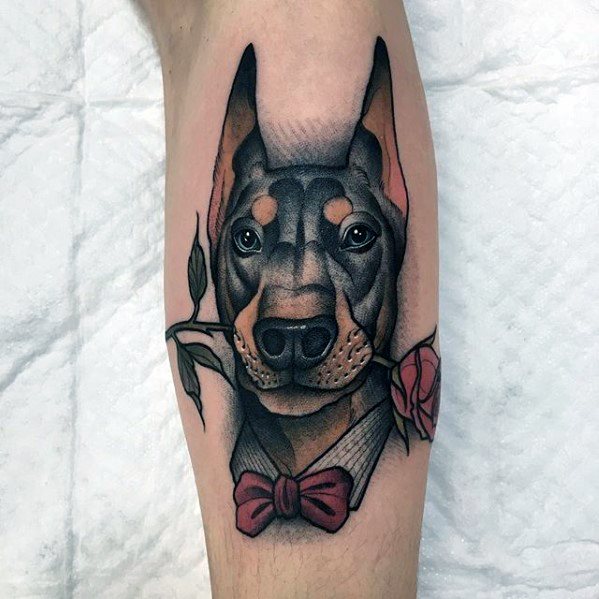 Tattoo of a doberman on the shin for men