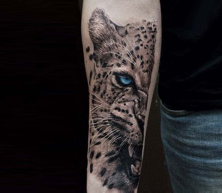 Leopard tattoo on the forearm for men