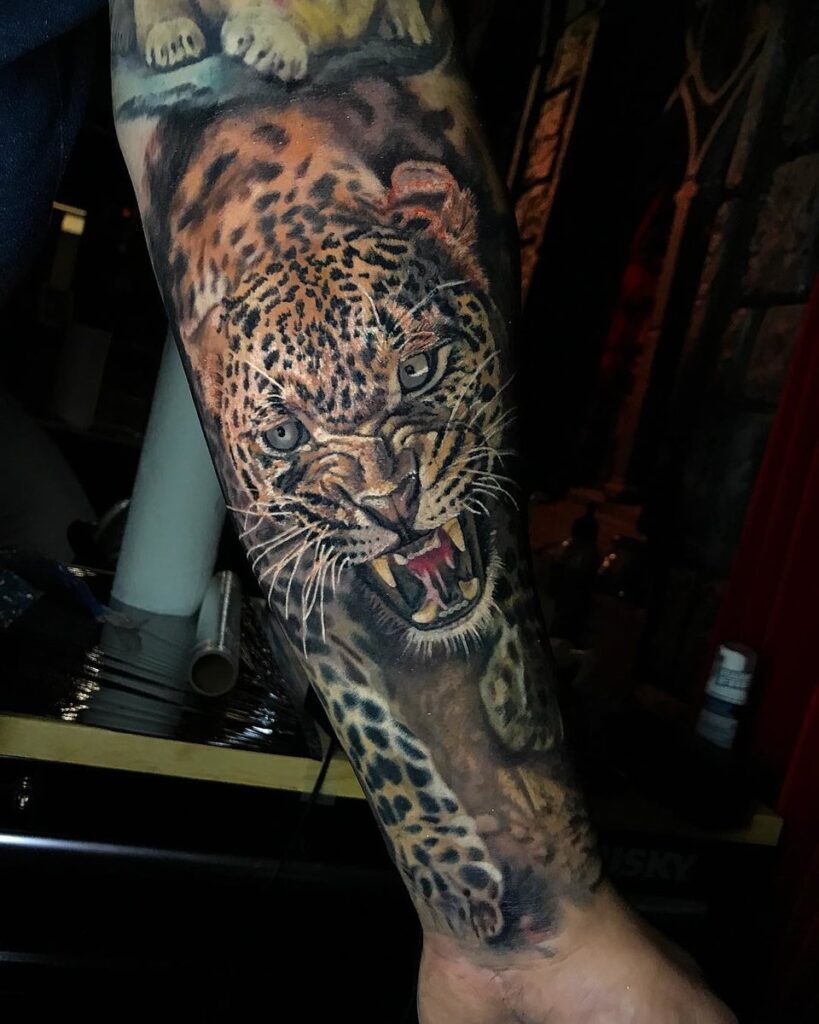 Leopard tattoo on the arm for men