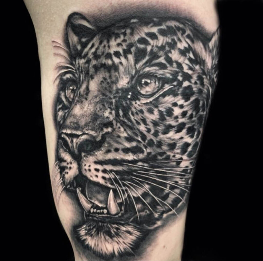 Leopard tattoo on the shoulder for men