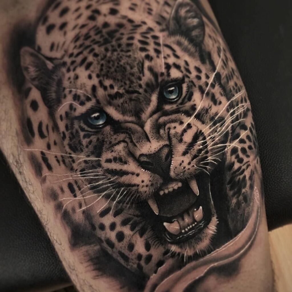 Leopard tattoo on the shoulder for men