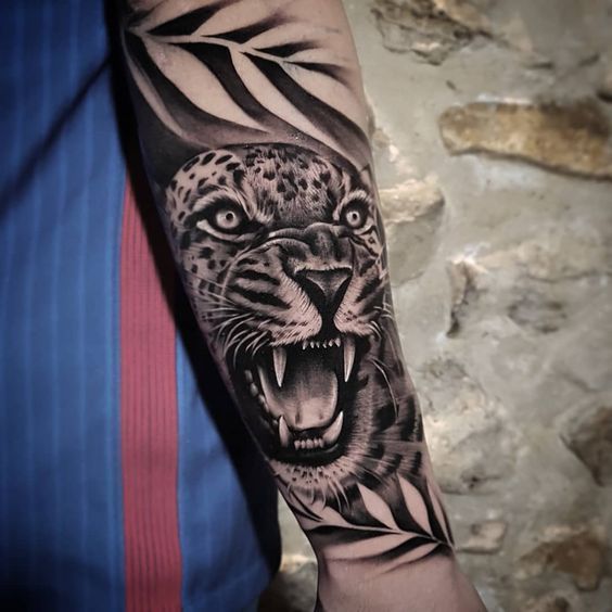 Leopard tattoo on the forearm for men