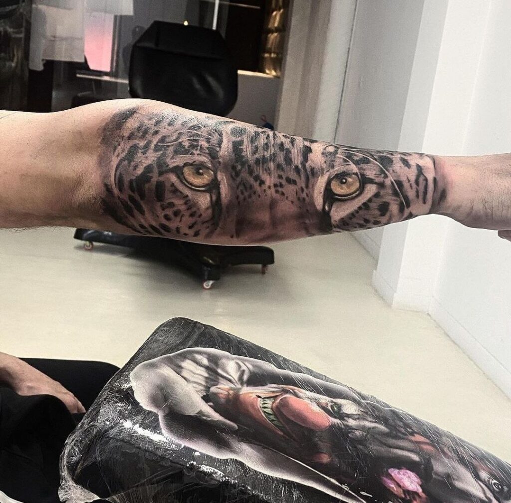 Leopard tattoo on the forearm for men