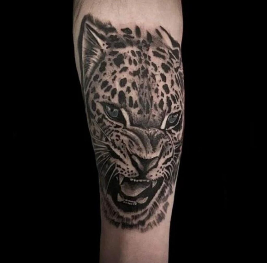 Leopard tattoo on the forearm for men