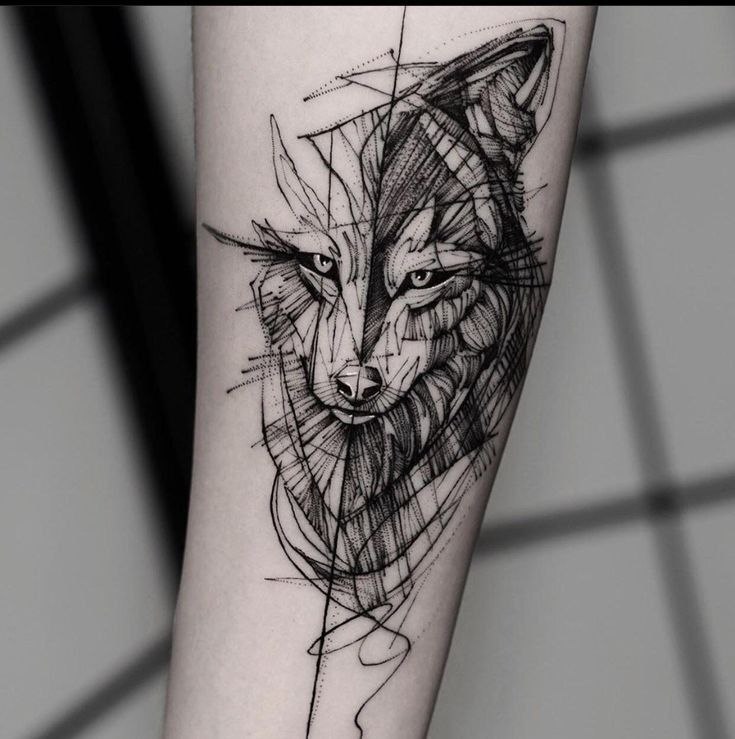 Tattoo of a wolf on the arm for women