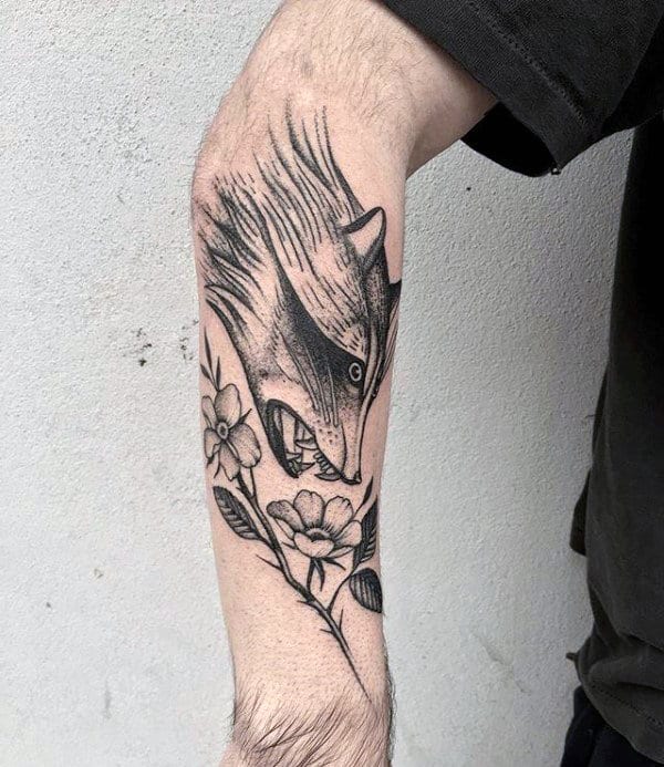 Tattoo of a raccoon on the hand for men