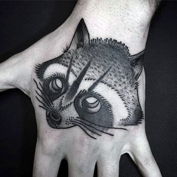 Raccoon tattoo on the hand for men