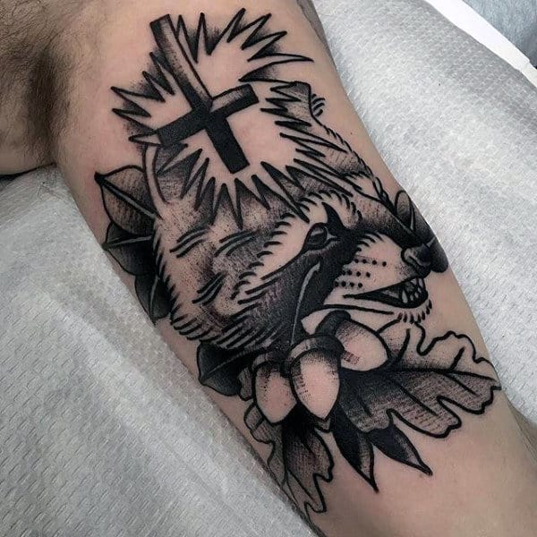 Tattoo of a raccoon on the shoulder for men