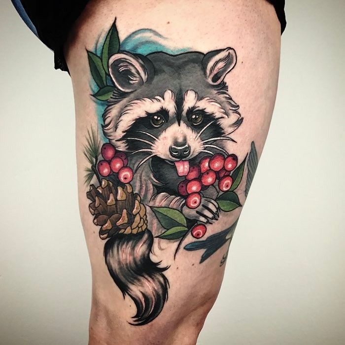 Tattoo of a raccoon on the hip for men