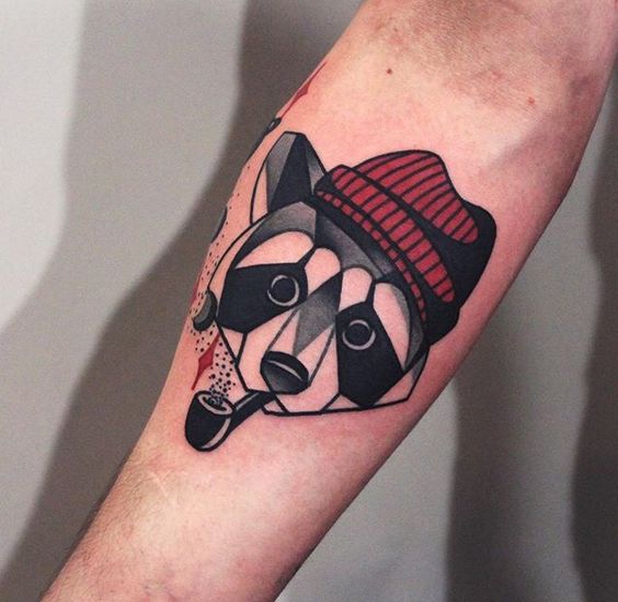 Tattoo of a raccoon on the forearm for men