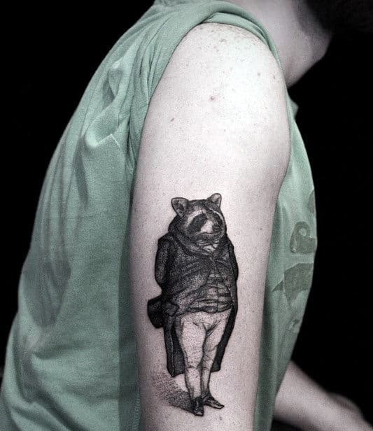 Tattoo of a raccoon on the shoulder for men