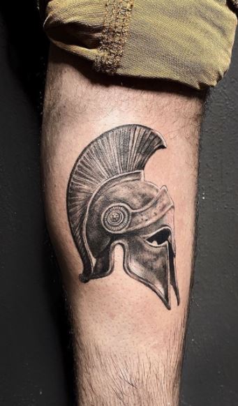 Spartan tattoo on the shin for men