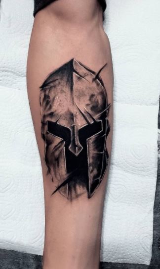 Spartan tattoo on the shin for men